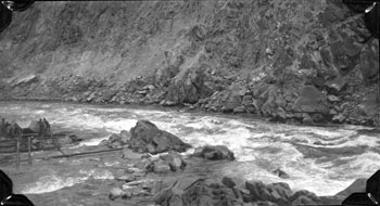 “Some Pelly River snaps. July - 1923  Some bad water in Hoole Canyon. Navigation troubles - portaging the scow.”