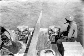 “A pictorial Record of the trip to Hoole Canyon by scow July 1929. Engines working smoothly - Engineer [Del Van Gorder] enjoys a pipe.”