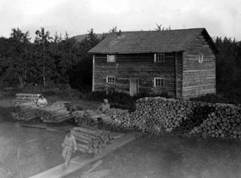 “The deck-hands ‘wooding-up’ Forty-Mile June 1932 About 5 a.m.”