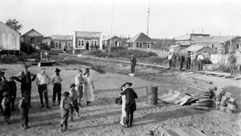 “the Day. Aug. 2, 1925” Claude and Mary embracing on their wedding day in the centre of Fort Yukon. The wedding was a big event in the tiny community, and almost the entire town came out to witness the nuptials of the Mountie and the nurse.