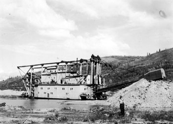 Claude standing near YCGC dredge #4 at the Arlington, summer 1939.