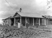 “Some local views in and around Mayo. Yukon Territory 1932. A good specimen of a Yukoner's cabin.” Alex Nicol poses outside his log home, and shows off his flourishing garden.