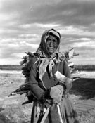 Margaret Black Fox with a load of firewood, June 1946.