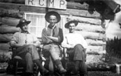 Claude (centre) poses with Robert McCleary (left) and F.W. Miller (right) at RCMP post in Teslin.